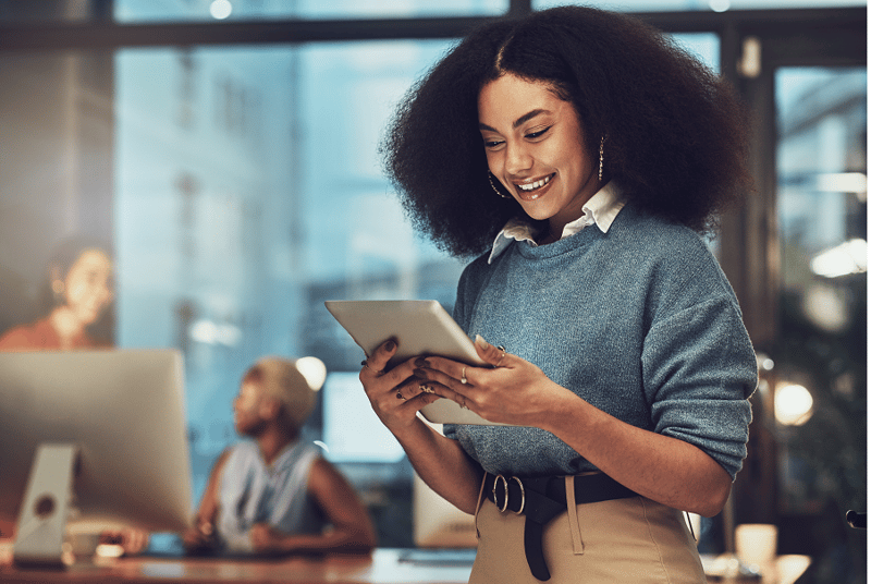 Smiling woman looking at tablet